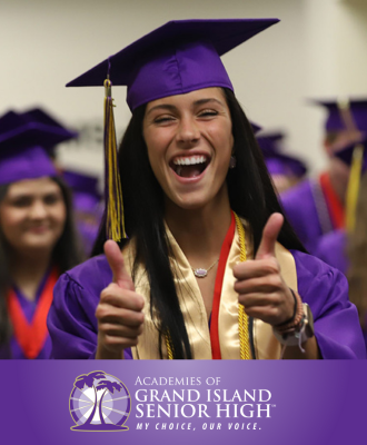  Smiling GISH graduate holding thumbs up while wearing graduation regalia